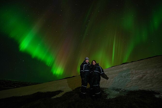 Award Winning Private Northern Lights Tour with All Inclusive - All-inclusive warmth: jumpsuits, hot drinks, snacks, and liquor