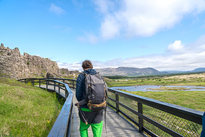 Combo Tour: Private Golden circle with Secret Lagoon Experience - Stop 5 at Kerið: red slopes, turquoise water, and a volcanic rim walk
