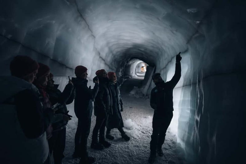From Húsafell: Into the Glacier Ice Cave Adventure - The Ice Tunnel Walk: Glowing Blue Layers and Volcanic Ash