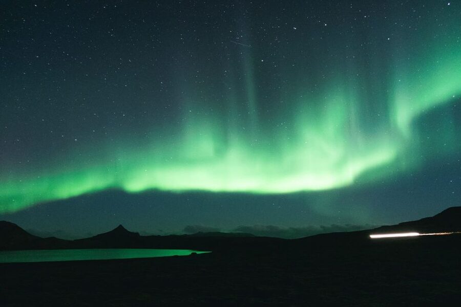 From Reykjavik: Northern Lights Sightseeing Cruise - What the view feels like: city lights, mountains, and ocean reflections