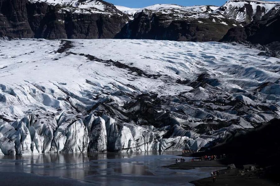 Iceland: South Coast Hidden Gems and Caves of Hella Day Tour - Sólheimajökull glacier time: iconic ice with real scale