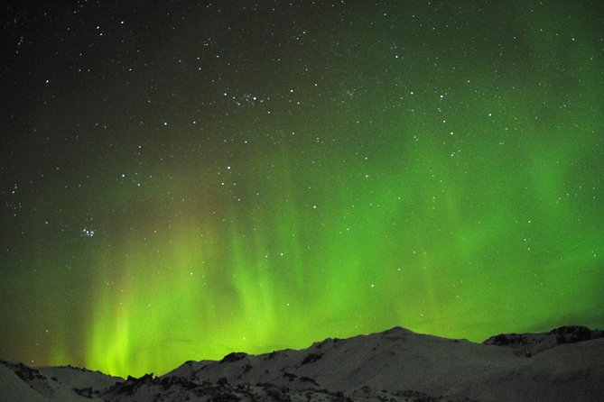Northern Lights Minibus Tour with Hot Cocoa, Blankets & Photos - Leaving Reykjavik Light Pollution for Better Aurora Odds