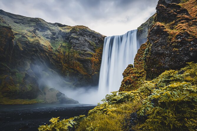 Paragliding and South Coast Waterfalls Day Tour from Reykjavík - Vík village time: black sand vibes and quick church views