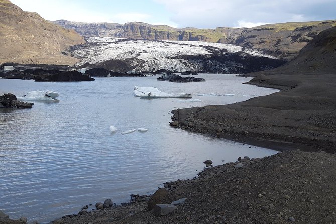 Private South Coast Tour from Reykjavik - Sólheimajökull glacier lagoon: floating icebergs and icy shoreline moments