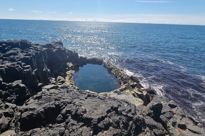 Reykjanes Peninsula Private Volcano Hike and Sky Lagoon Spa Tour - Brimketill: the surf cauldron rock pool with geothermal warmth