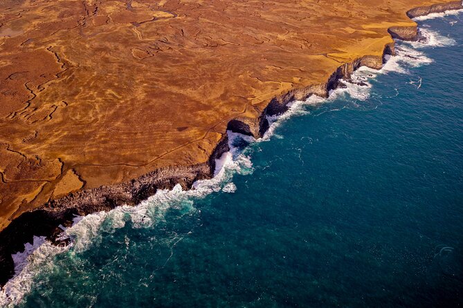 Reykjavik Helicopter Private Tour of Volcanoes - Coastal cliffs and nesting birds, plus that Atlantic open-water feeling