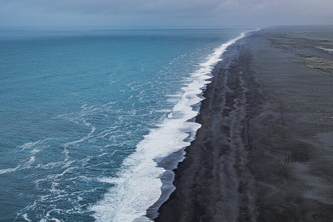 South Coast and Glacier Walk Full day Private Tour From Reykjavík - Reynisfjara black sand and Reynisdrangar: wind, drama, and filming fame